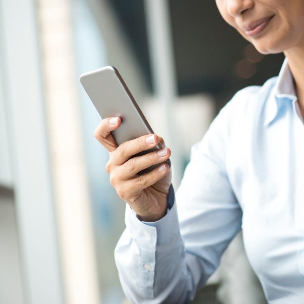 business woman holding mobile phone